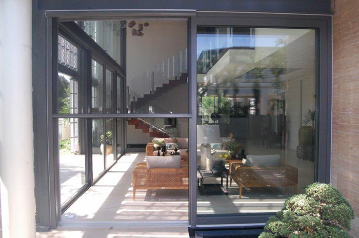 Large opening to a home with a retractable screen lowered